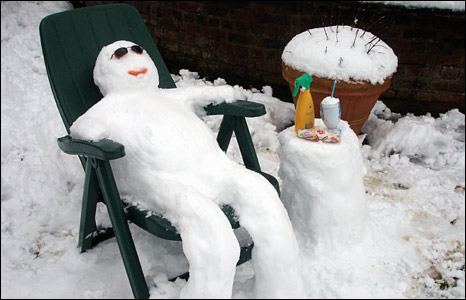 image shows snowman getting sun