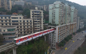 image shows monorail going through a building