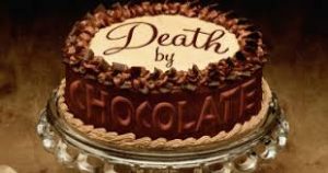 image shows a cake that says death by chocolate