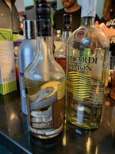 image shows snake in alcohol bottle