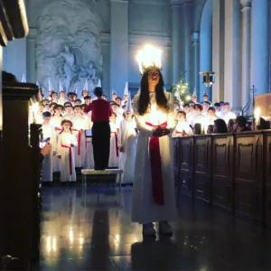 image shows a girl dressed as St. Lucia