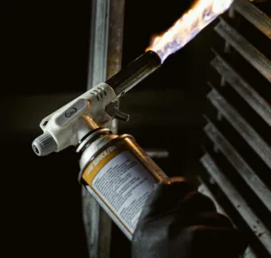 image shows a blow torch