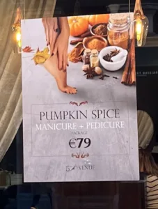 image shows sign advertising a pumpkin spice manicure and pedicure